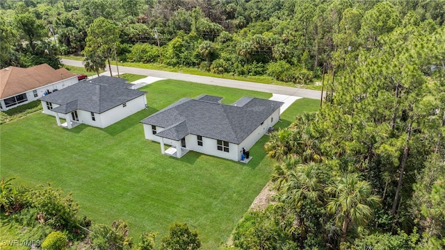 2605 28th St W, Lehigh Acres, FL 33971 - aerial view of property and surrounding area with a heavily wooded area