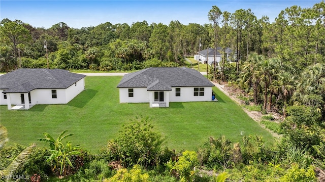 2605 28th St W, Lehigh Acres, FL 33971 - aerial view of property and surrounding area featuring a forest