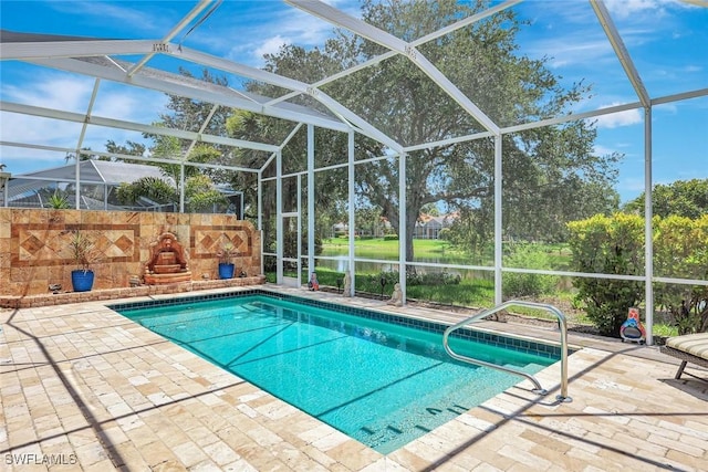 3008 Ellice Way, Naples, FL 34119 - swimming pool featuring a patio area, a lanai, and a water view