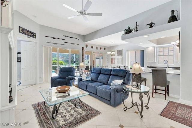 3008 Ellice Way, Naples, FL 34119 - living area featuring a chandelier, ceiling fan, and light tile patterned floors