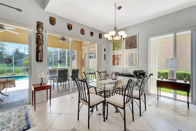 3008 Ellice Way, Naples, FL 34119 - dining space with a ceiling fan, a chandelier, and light tile patterned floors