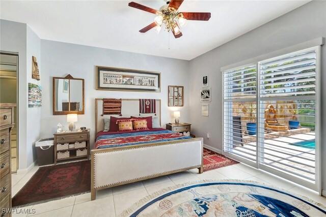 3008 Ellice Way, Naples, FL 34119 - tiled bedroom with baseboards and a ceiling fan