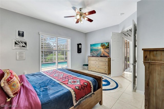 3008 Ellice Way, Naples, FL 34119 - bedroom with access to outside, light tile patterned floors, and ceiling fan