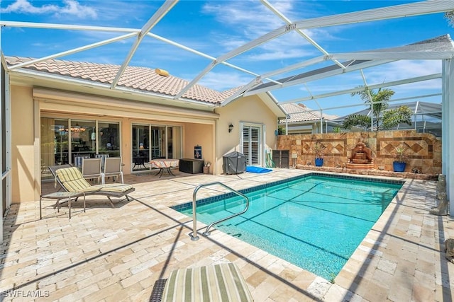 3008 Ellice Way, Naples, FL 34119 - view of swimming pool featuring a patio area and glass enclosure