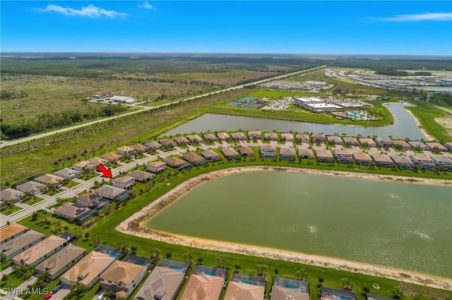 20028 Napa Loop, Estero, FL 33928 - aerial view of property and surrounding area featuring a large body of water and nearby suburban area