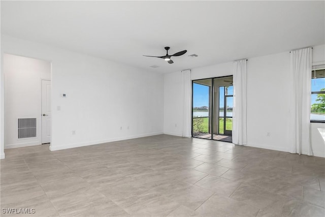 20028 Napa Loop, Estero, FL 33928 - spare room featuring a ceiling fan and baseboards