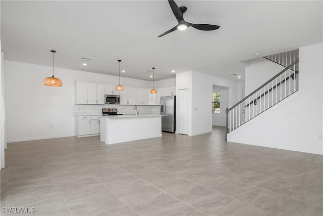 20028 Napa Loop, Estero, FL 33928 - unfurnished living room with a ceiling fan, recessed lighting, and stairway