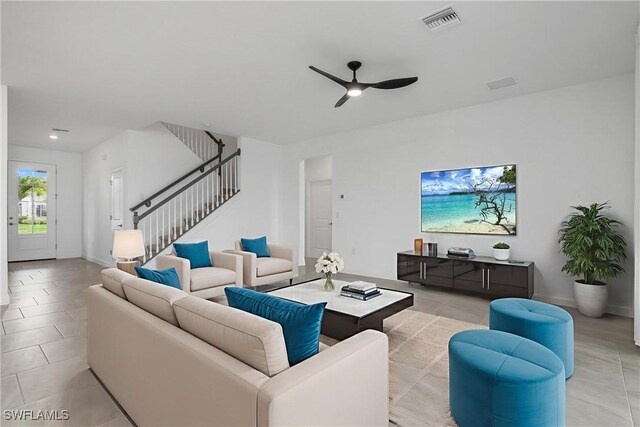 20028 Napa Loop, Estero, FL 33928 - living area featuring a ceiling fan, stairway, and light tile patterned floors