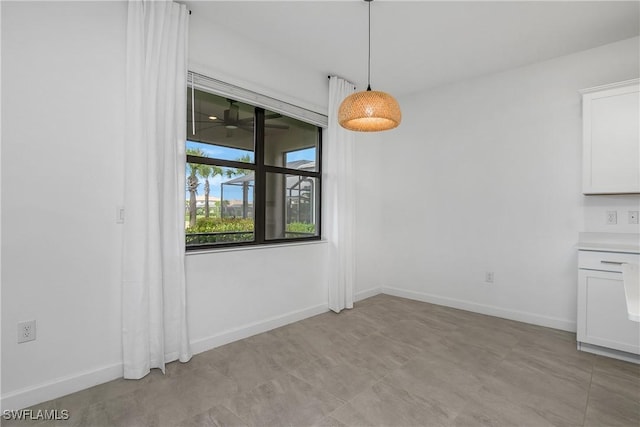 20028 Napa Loop, Estero, FL 33928 - unfurnished dining area with baseboards