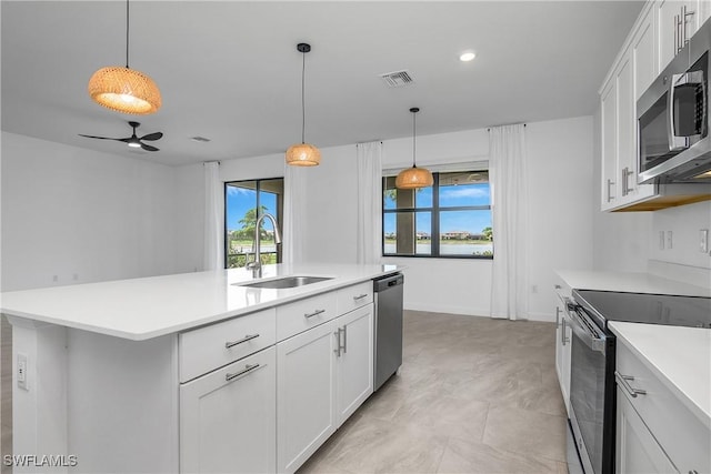 20028 Napa Loop, Estero, FL 33928 - kitchen featuring appliances with stainless steel finishes, light countertops, white cabinetry, ceiling fan, and recessed lighting