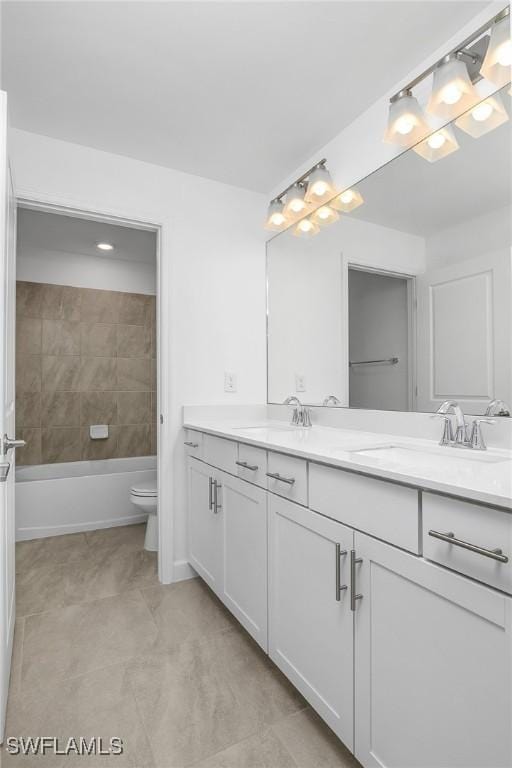 20028 Napa Loop, Estero, FL 33928 - full bathroom featuring double vanity and toilet