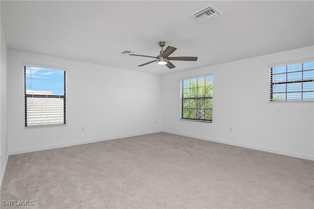 20028 Napa Loop, Estero, FL 33928 - unfurnished room with plenty of natural light, ceiling fan, and carpet flooring