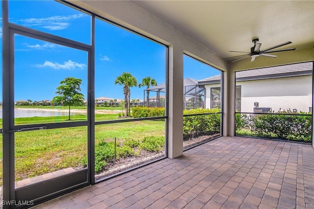 20028 Napa Loop, Estero, FL 33928 - unfurnished sunroom featuring a water view and ceiling fan