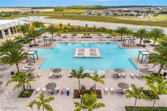 20028 Napa Loop, Estero, FL 33928 - community pool with a water view and a patio area
