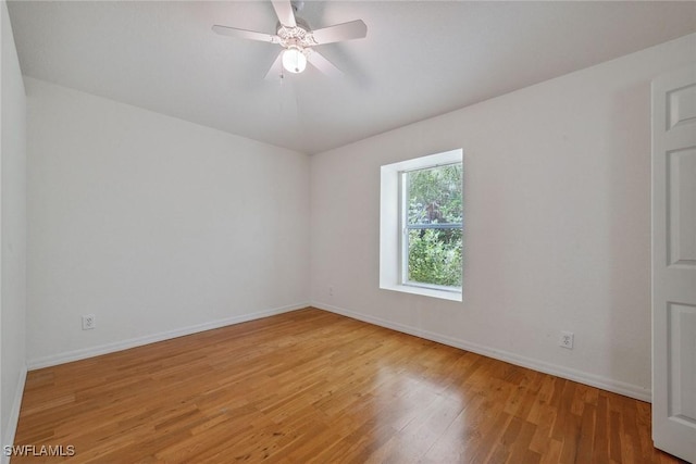 3210 2nd Ave SE, Naples, FL 34117 - unfurnished room featuring light wood-style floors and a ceiling fan
