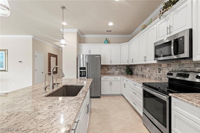 11288 Red Bluff Ln, Fort Myers, FL 33912 - kitchen featuring appliances with stainless steel finishes, ornamental molding, tasteful backsplash, and white cabinets