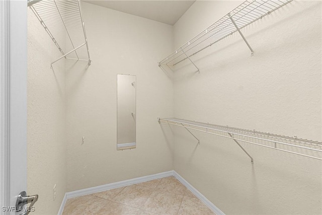 11288 Red Bluff Ln, Fort Myers, FL 33912 - spacious closet featuring light tile patterned floors
