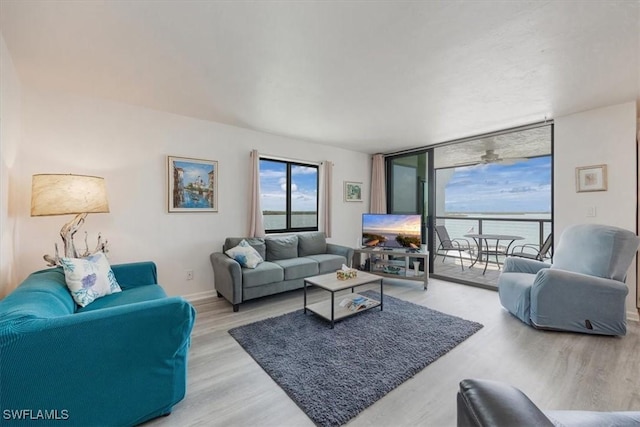 1085 Bald Eagle Dr Unit F409, Marco Island, FL 34145 - living area featuring wood finished floors and floor to ceiling windows