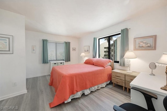 1085 Bald Eagle Dr Unit F409, Marco Island, FL 34145 - bedroom with light wood-style flooring and baseboards