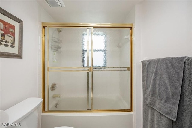 1085 Bald Eagle Dr Unit F409, Marco Island, FL 34145 - bathroom featuring toilet and combined bath / shower with glass door