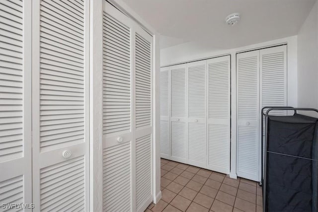 1085 Bald Eagle Dr Unit F409, Marco Island, FL 34145 - hallway with light tile patterned flooring