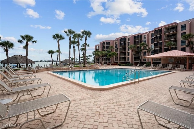 1085 Bald Eagle Dr Unit F409, Marco Island, FL 34145 - community pool featuring a gazebo, a patio, and a water view