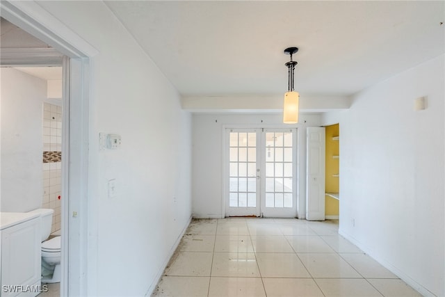 2414 Braman Ave, Fort Myers, FL 33901 - spare room with french doors and light tile patterned floors