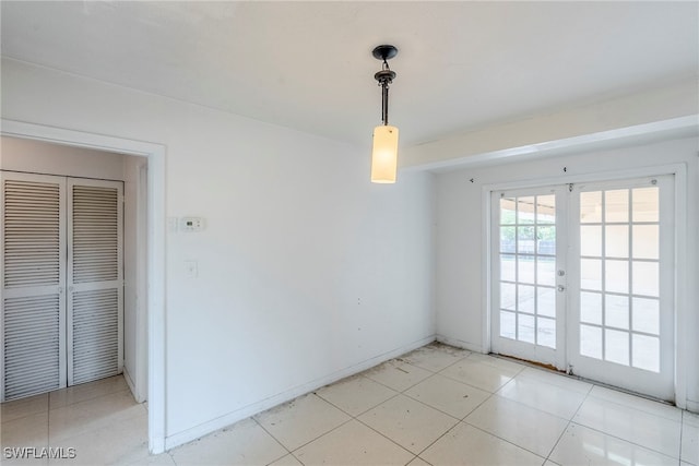 2414 Braman Ave, Fort Myers, FL 33901 - unfurnished dining area with french doors and baseboards