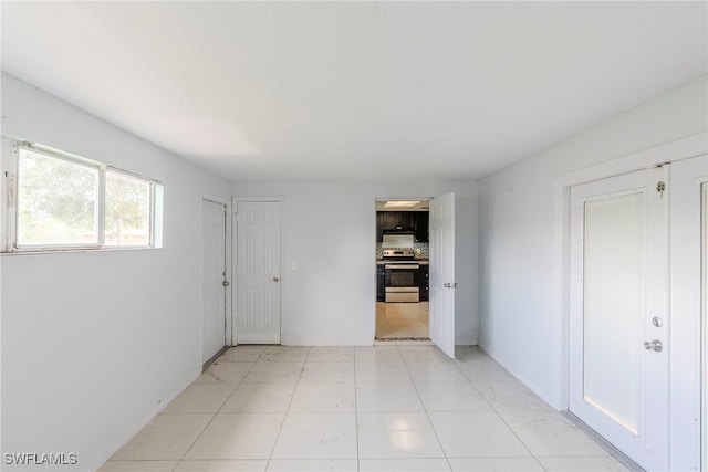 2414 Braman Ave, Fort Myers, FL 33901 - hall featuring light tile patterned floors