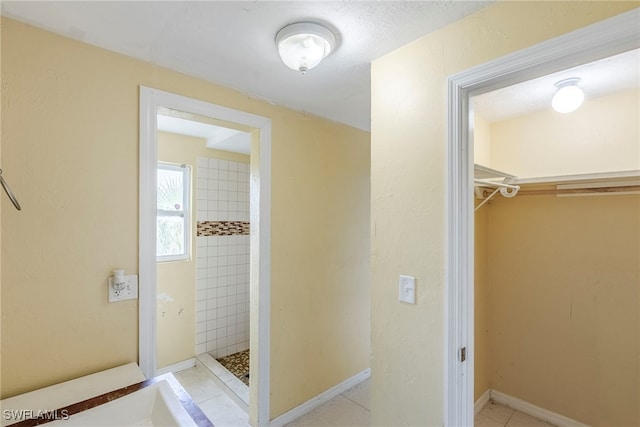 2414 Braman Ave, Fort Myers, FL 33901 - full bath with a tile shower, a spacious closet, and tile patterned flooring