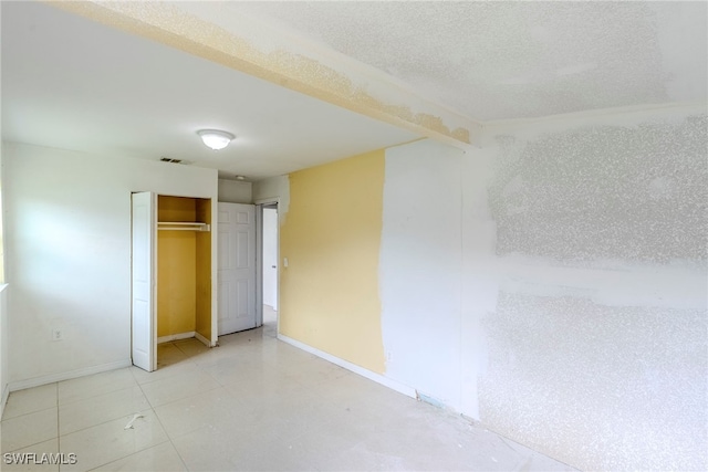2414 Braman Ave, Fort Myers, FL 33901 - unfurnished bedroom featuring a closet and baseboards