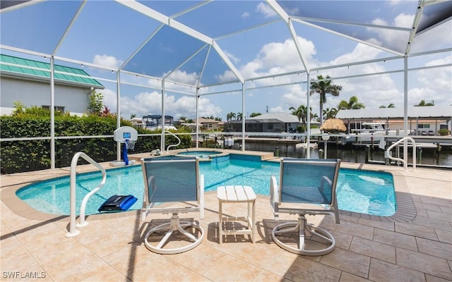1221 SW 53rd Ter, Cape Coral, FL 33914 - view of swimming pool featuring a pool with connected hot tub, a patio area, a lanai, and a water view