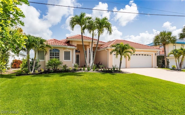 1221 SW 53rd Ter, Cape Coral, FL 33914 - mediterranean / spanish-style home with stucco siding, a garage, a tiled roof, and a front yard