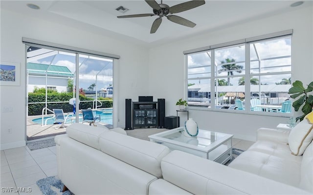 1221 SW 53rd Ter, Cape Coral, FL 33914 - living room with a ceiling fan and light tile patterned floors