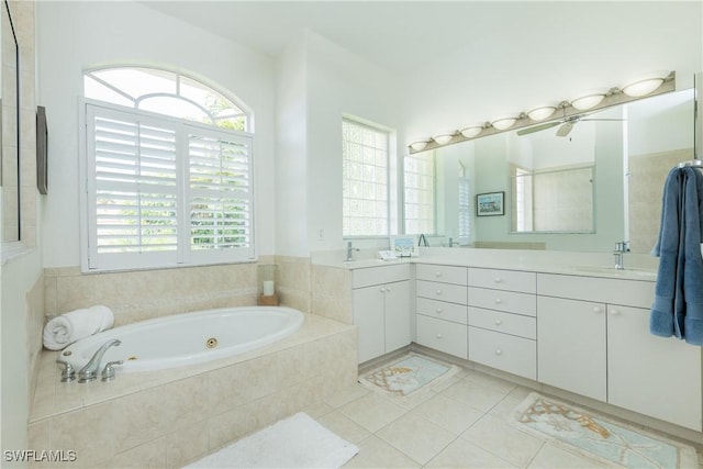 1221 SW 53rd Ter, Cape Coral, FL 33914 - bathroom with double vanity, a tub with jets, and tile patterned floors