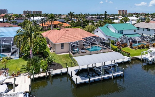 1221 SW 53rd Ter, Cape Coral, FL 33914 - dock featuring boat lift, a water view, an outdoor pool, and a lanai