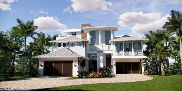 938 San Carlos Dr, Fort Myers Beach, FL 33931 - view of front of house with a balcony, a standing seam roof, decorative driveway, a garage, and a front lawn