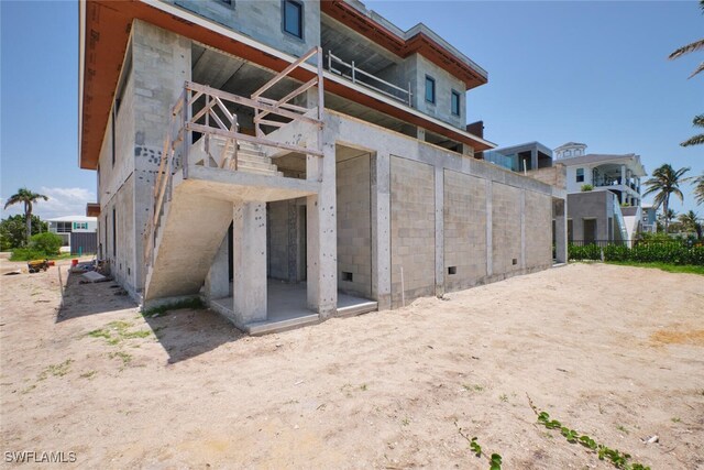 938 San Carlos Dr, Fort Myers Beach, FL 33931 - back of house with concrete block siding