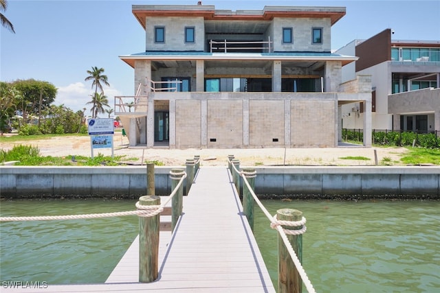 938 San Carlos Dr, Fort Myers Beach, FL 33931 - dock area with a water view and a balcony