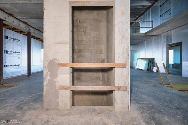 938 San Carlos Dr, Fort Myers Beach, FL 33931 - stairway featuring unfinished concrete flooring