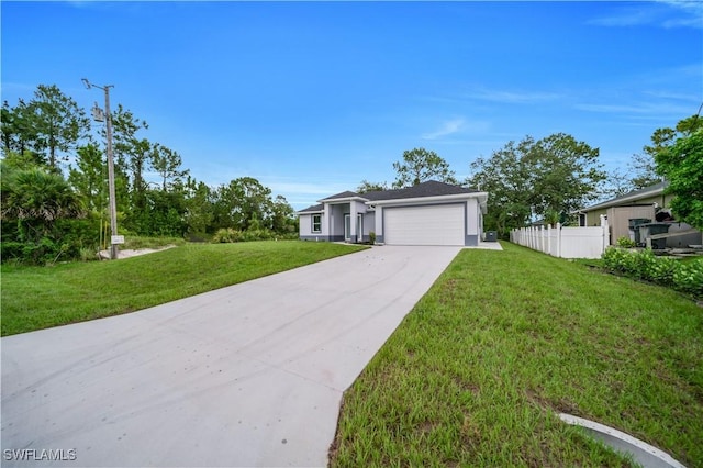 3103 Karen Ave S, Lehigh Acres, FL 33976 - view of front of property featuring driveway and a garage