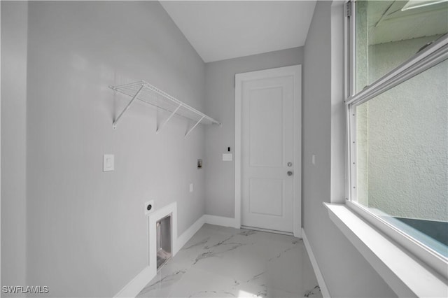 3103 Karen Ave S, Lehigh Acres, FL 33976 - laundry area with electric dryer hookup, marble finish flooring, and healthy amount of natural light