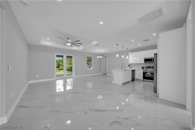 3103 Karen Ave S, Lehigh Acres, FL 33976 - unfurnished living room featuring ceiling fan, recessed lighting, and light marble finish flooring