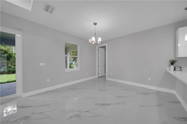 3103 Karen Ave S, Lehigh Acres, FL 33976 - unfurnished dining area featuring a chandelier and marble finish flooring