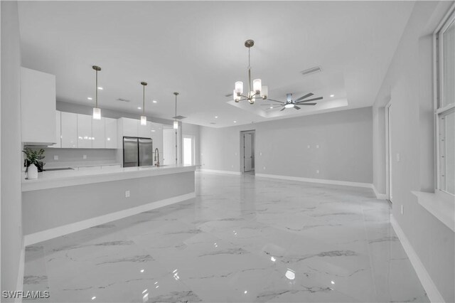 3103 Karen Ave S, Lehigh Acres, FL 33976 - unfurnished living room featuring a chandelier, recessed lighting, and light marble finish floors