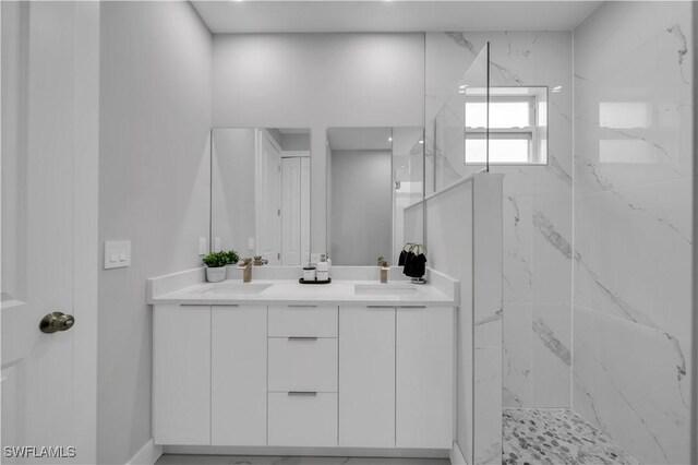 3103 Karen Ave S, Lehigh Acres, FL 33976 - bathroom featuring a marble finish shower and double vanity