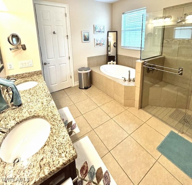 20608 Long Pond Rd, North Fort Myers, FL 33917 - bathroom featuring double vanity, tile patterned flooring, a shower stall, and a bath
