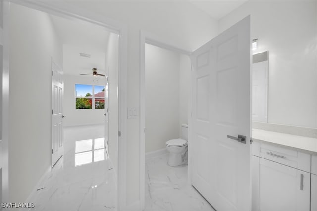 2817 22nd St W, Lehigh Acres, FL 33971 - bathroom featuring marble look tile flooring, vanity, and a ceiling fan