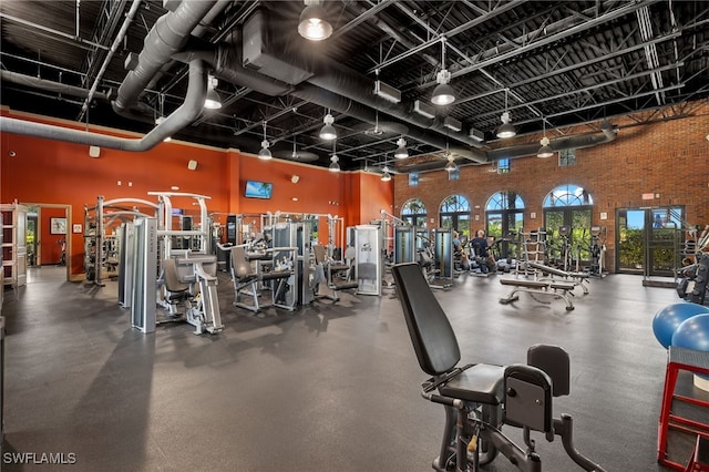 11999 Palba Way Unit 6405, Fort Myers, FL 33912 - gym with a towering ceiling and track lighting