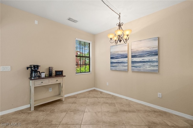 11999 Palba Way Unit 6405, Fort Myers, FL 33912 - spare room with a chandelier and baseboards